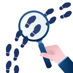 Inspecting or following footsteps concept. Hand holding magnifying glass over footprint symbols. Search right way for development.