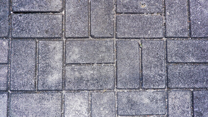 View From Above Of A Sidewalk Floor Surface Made Of Old Square Stones In Gray Color