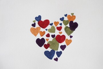 Hand drawing heart shape on white paper