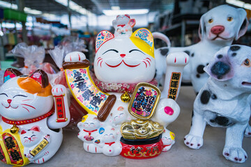 Nonthaburii, Thailand - June, 24, 2024 : Lucky Charms: Maneki-neko Figurines for Prosperity at Nonthaburii, Thailand.