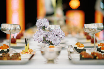 Elegant banquet table set for a formal dining experience featuring gourmet appetizers