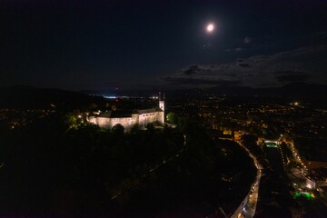 Historic Castle at Night Under Full Moon