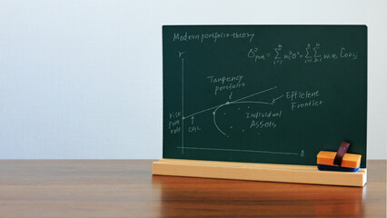 Investment theory studied in economics and financial engineering: blackboard with graphs and...