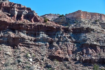 Desert cliff formations under blue sky