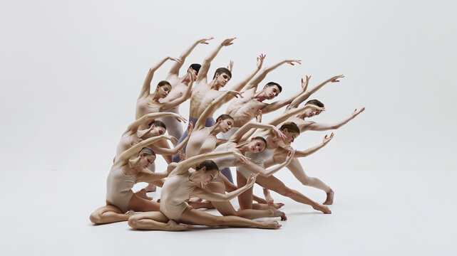 Ballet dancers performing contemporary piece with expressive movements, demonstrating blend of modern art and traditional ballet techniques in visually stunning display. Art, classical dance concept