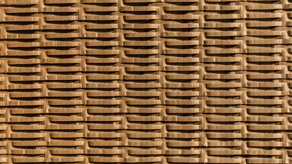 Stacked cardboard boxes create a textured pattern, symbolizing sustainability and recycling concepts, ideal for Earth Day themes