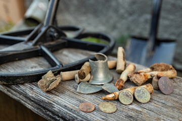 The result of searching for coins using a metal detector and a shovel.