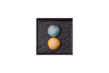 Delicious colorful asian mochi sweets with rice dough shell and fruit filling