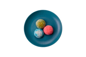 Delicious colorful asian mochi sweets with rice dough shell and fruit filling