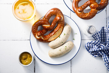 White sausages with salted pretzel