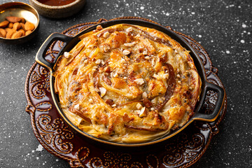 Phyllo pastry pie with pear, gorgonzola cheese, almond and honey close up