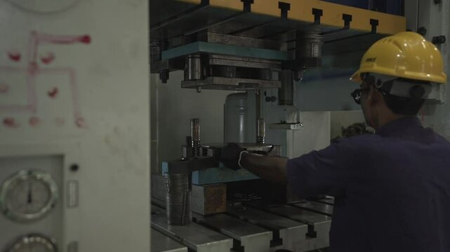worker in factory punching