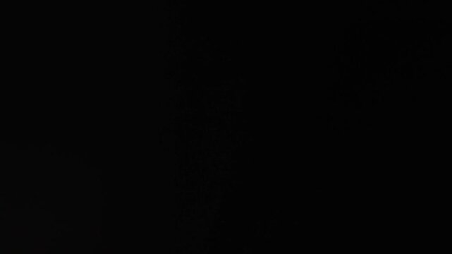 White lens flare overlay on black background. Spherical Optical Prism Light abstract background 4K. High quality 4k footage