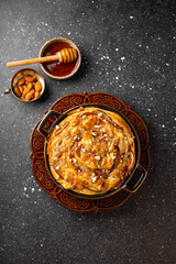 Phyllo pastry pie with pear, gorgonzola cheese, almond and honey, top view vertical photo