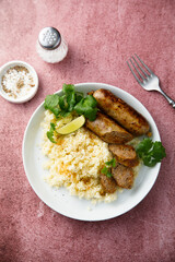 Homemade sausages with couscous