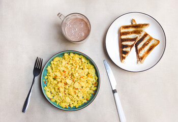 scrambled eggs, toast and chocolate milk on the table as a breakfast menu.food photography