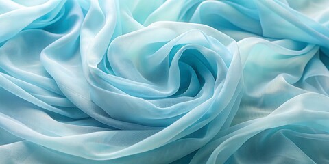Obraz premium Elegant Light Blue Chiffon Fabric Closeup with Swirling Folds for Ethereal Background, Soft Drapery, Textures, and Delicate Aesthetics in Conceptual Photography