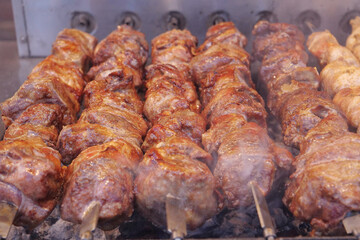Kebabs on skewers are grilled on hot coals