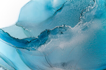 Beautiful background with smudges and stains alcohol ink. Abstract blue, red art with gold.