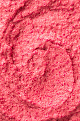 Fruit pink ice cream. Yogurt smoothie with fresh fruits and berries. Ice cream texture. Delicious sweet dessert close-up as background.