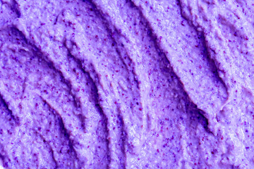 Lilac berry yogurt ice cream with blueberries, blackberries and bilberries. Fresh fruit and berry smoothie. Ice cream texture. Delicious sweet dessert close-up as background.