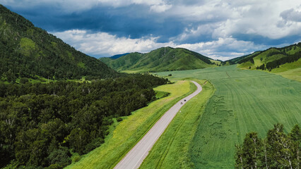 Fototapeta premium the car is driving along a mountain road in Altai