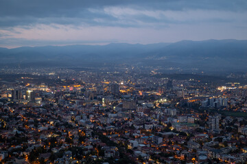 City illuminated at dusk, seen from above. The European capital of North Macedonia, Skopje.