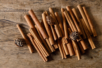 cinnamon sticks on wooden background