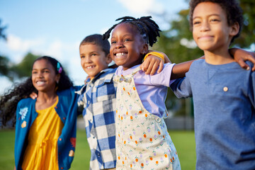Multiethnic group of children friends enjoy together while hugging