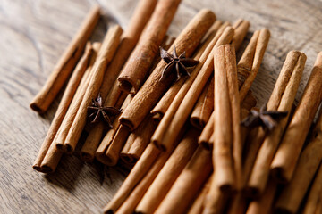 cinnamon sticks on wooden background