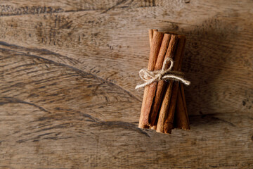 cinnamon sticks on wooden background