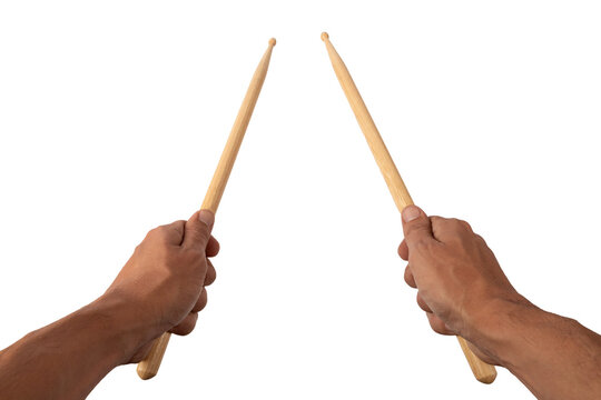 Male hands holding drum sticks isolated on white background