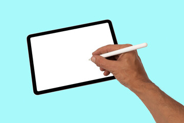 Male hand drawing or writing on a tablet blanc screen with smart pencil cyan background