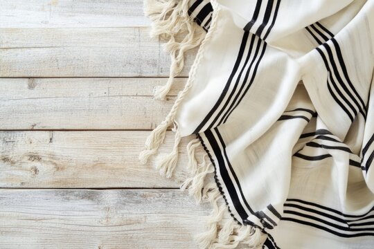 Traditional Decorative White and Black Striped Fouta Towel on Rustic Wooden Background - Ideal for Design, Print, Card, Poster