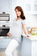 Pregnant, woman and happy with portrait in kitchen for healthy breakfast, prenatal nutrition and wellness. Person, food and lunch meal in home for pregnancy benefits, maternity health and baby growth