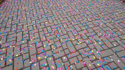 Obraz premium Street Covered with Colorful Confetti After a Festival