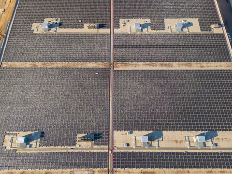 Eco building or factory in aerial view consist of solar or photovoltaic cell in panel on top of roof. Technology to generate electrical power, direct current electricity by light. Energy for future.