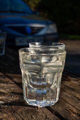 Glass with alcohol, on blurred background, drinking alcohol 