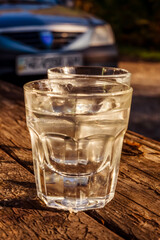 Glass with alcohol, on blurred background, drinking alcohol 