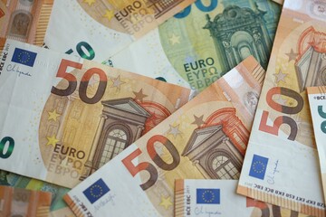 Pile of euro paper banknotes as finance background. Financial, saving or investment
