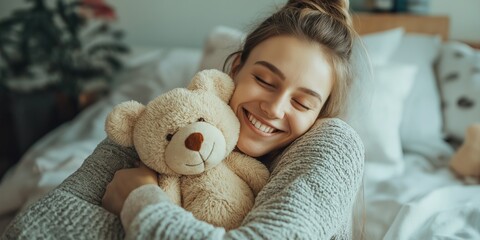 A young woman is hugging a teddy bear while smiling. Concept of warmth and comfort, as the woman is enjoying the company of her stuffed animal