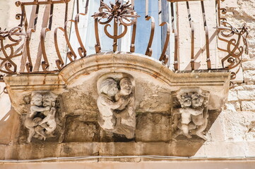 balcony details on a palace in Ragusa Ibla in Sicily