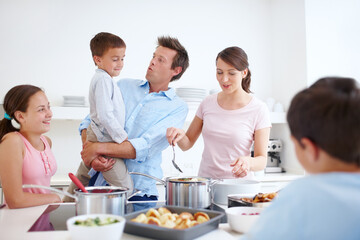 Family, happy and cooking in kitchen with love, Thanksgiving celebration and support. Parents, children and excited in home for meal preparation, nutritional lunch and smile in apartment for learning