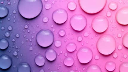 Water Drops on Gradient Background: Abstract close-up of water drops on a vibrant pink and purple gradient surface.