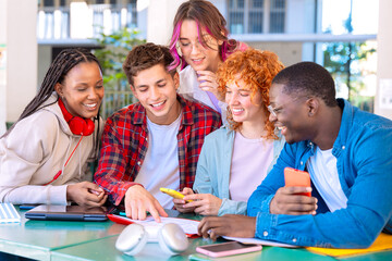Group happy teenage students talking with university notes. and smartphones