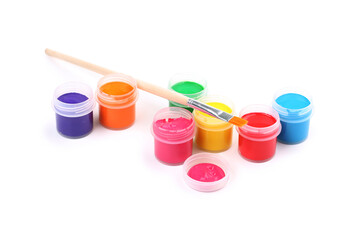 Colorful gouache paints and brush isolated on white background