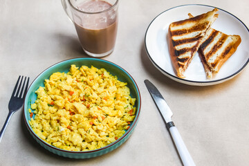 scrambled eggs, toast and chocolate milk on the table as a breakfast menu.food photography