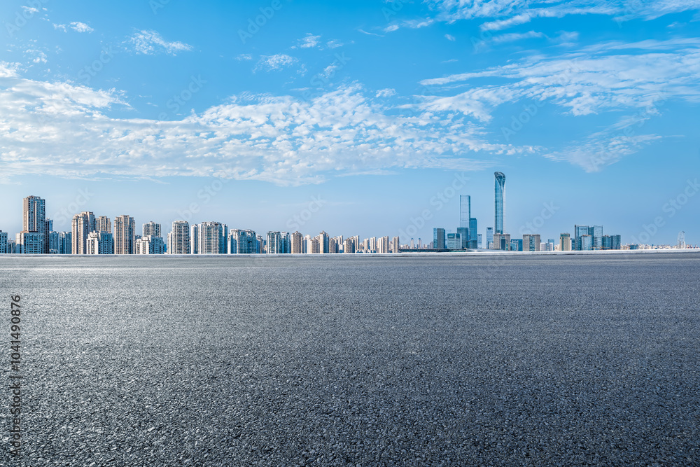 Sticker Empty asphalt road and cityscape with skyline in modern city