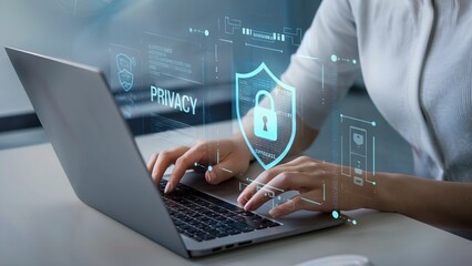 Fototapeta premium A person's hands typing on a laptop with a digital privacy lock and shield overlay.