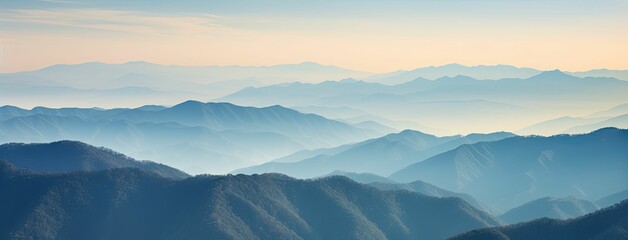 Misty mountain range at sunrise.